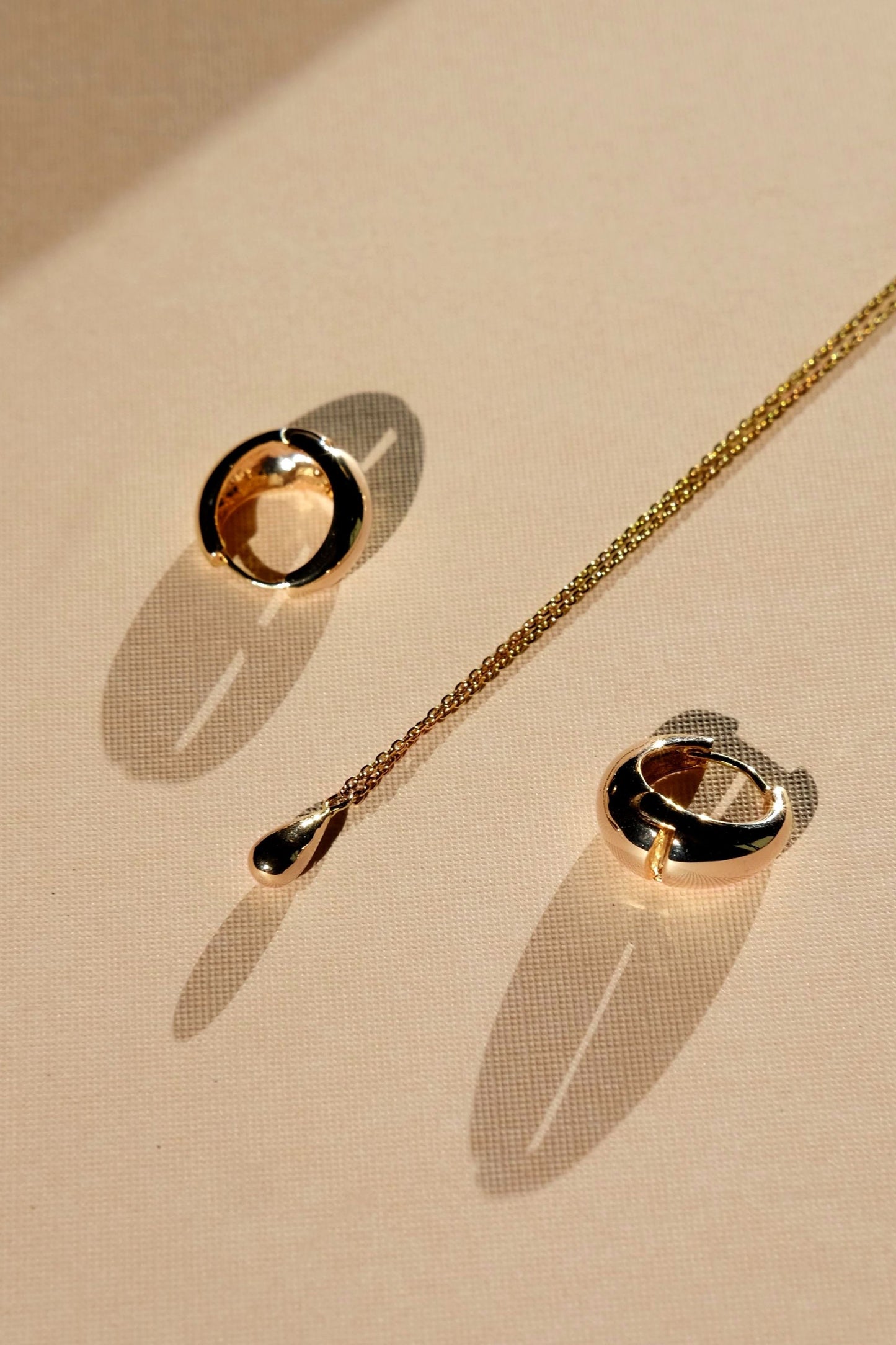 everyday minimal dainty jewelry dalhaejewelry timeless style capsule wardrobe staple minimalist fashion staple fine sterling silver gold vermeil teardrop necklace huggie hoop earrings
