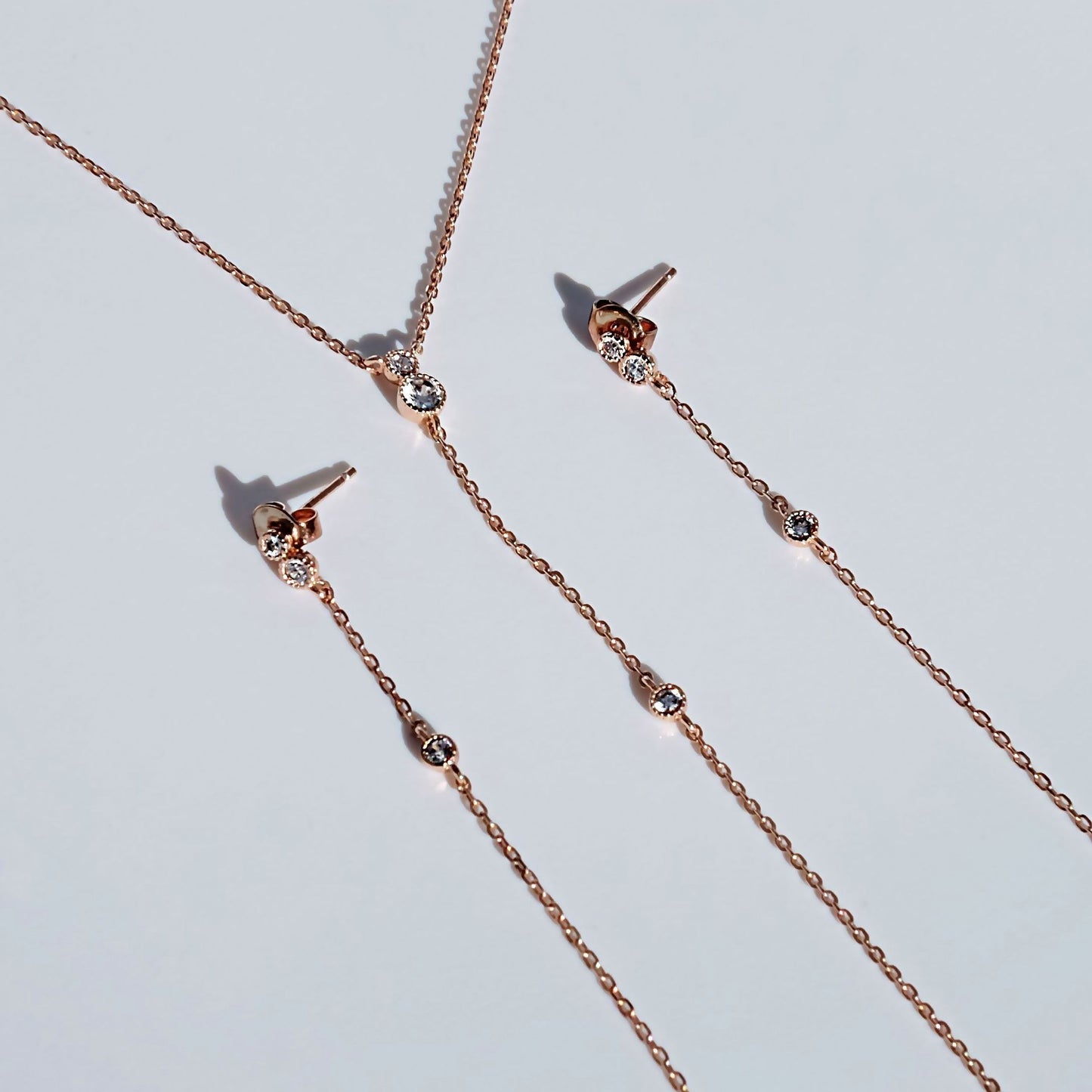 everyday minimal dainty jewelry dalhaejewelry timeless style capsule wardrobe staple minimalist fashion staple fine diamond stud earring diamond necklace cz rose gold lariat long necklace diamond drop earrings