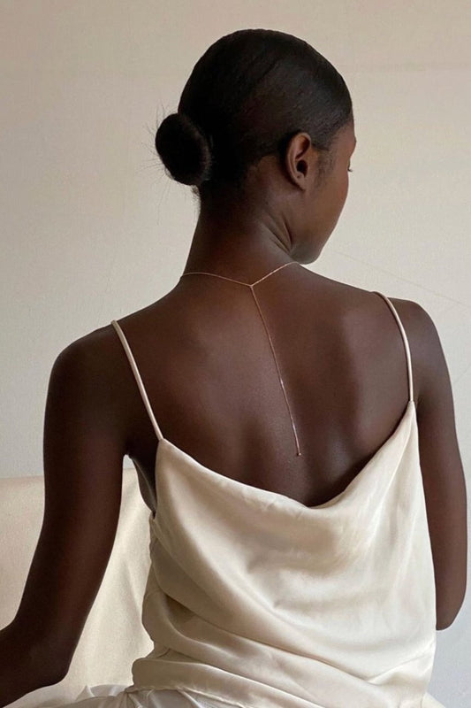 the one lariat long necklace @chainkyr timeless style capsule wardrobe dalhae jewelry minimal everyday dainty necklace rosegold silk slip dress ball drop necklace